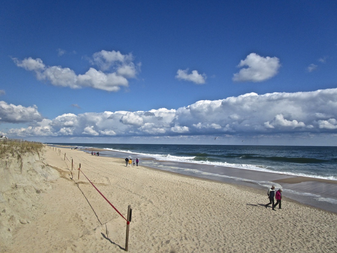 Bethany Beach, Delaware, USA. A long, low band of beautiful white clouds along the beach on the Atlantic Ocean. Depositphotos_390835494_l-2015