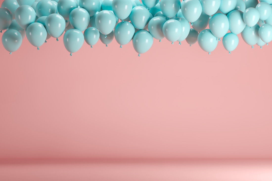 Blue balloons and pink background. 