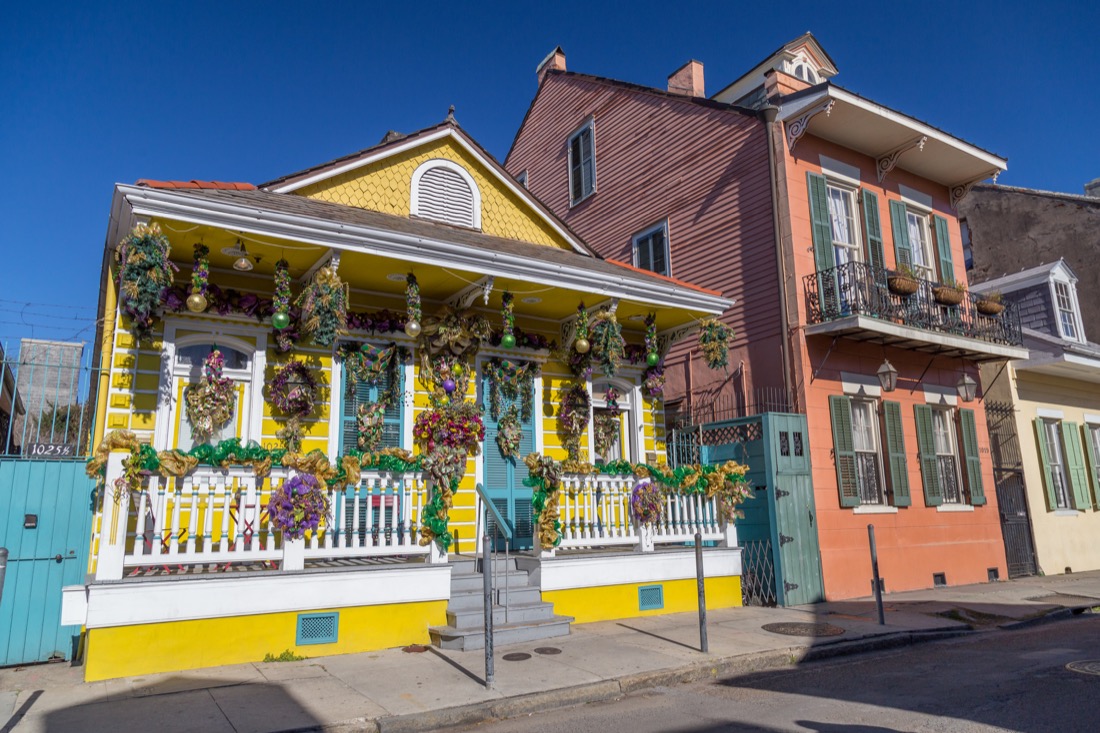 Colorful Old Colonial Houses on the Streets of French Quarter decorated for Mardi Gras in New Orleans