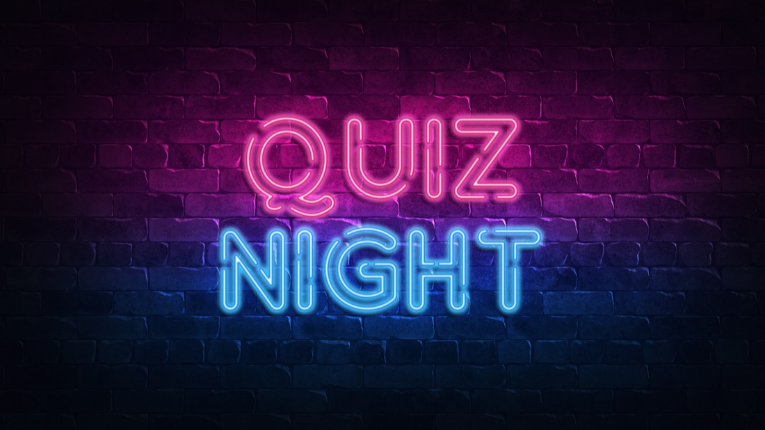 Quiz Night neon sign on wall