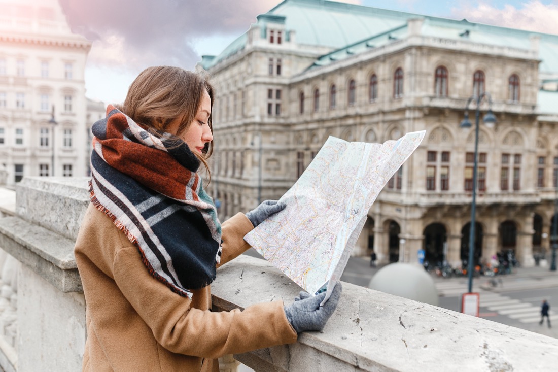 Woman looking at map on a travel.