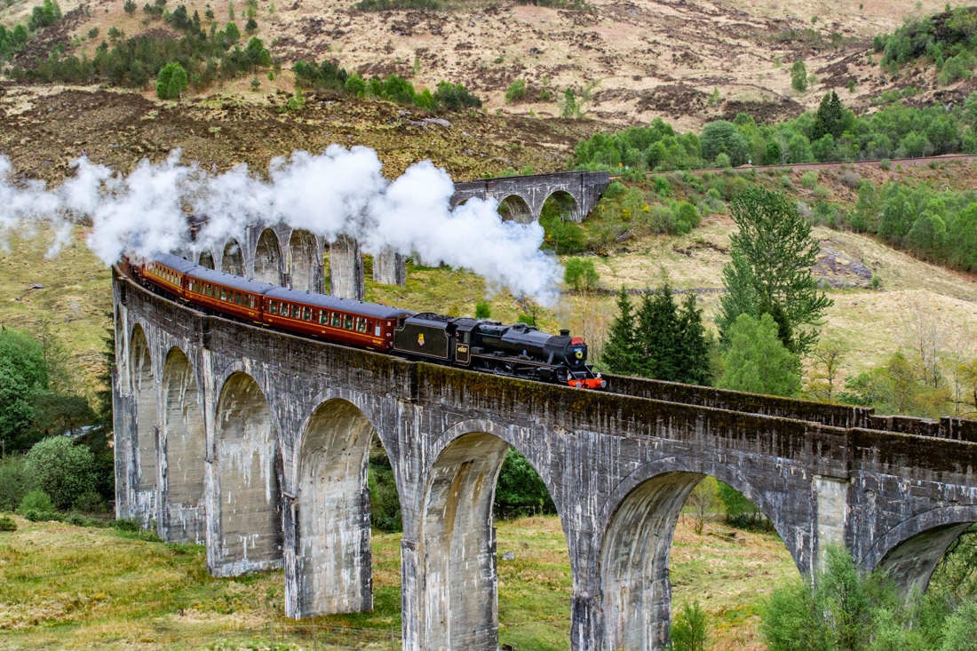 Jacobite Steam Train Hogwarts Train going over Viaduct in Scotland